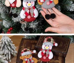 Detailed view of handmade Christmas plush ornaments featuring snowman and bear designs