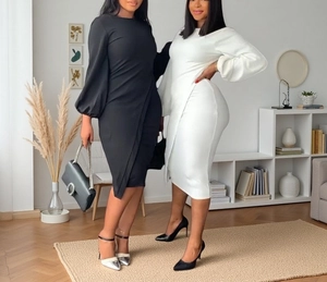 Detail of lantern sleeves and asymmetrical pleats on chic black and white slim midi dresses