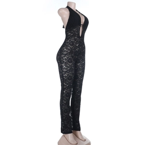 Detailed side view showing delicate floral lace patterns and slim fit on a black jumpsuit