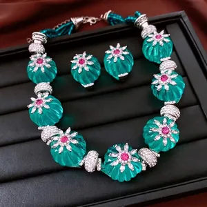 Parure de bijoux exotiques avec perles de citrouille vertes et pendentifs fleuris
