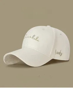 Detailed close-up of premium cotton baseball cap with golden silk lucky embroidery