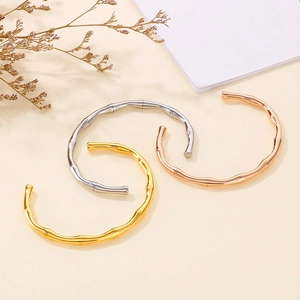 Detailed view of bamboo joint bracelets in gold, silver, and rose gold finishes