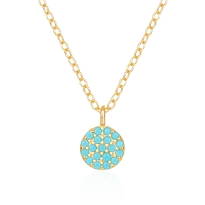 Macro shot of turquoise sunflower pendant in gold finish with micro-inlaid blue stones