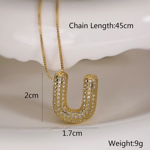 Detail of gold zircon initial pendant with size dimensions and 45cm chain length