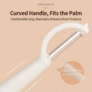 Ergonomic white stainless steel vegetable peeler with a modern curved handle design