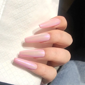 Detail of long coffin nails with pink aurora chrome finish and pearlescent shine