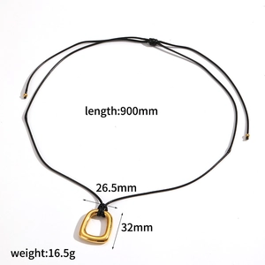 Detail view of gold square pendant with dimensions 32x26.5mm and 900mm black cord