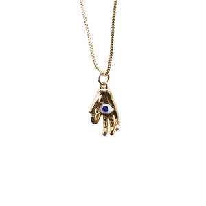 Gold Hamsa hand pendant necklace with blue evil eye charm on a polished fine chain link