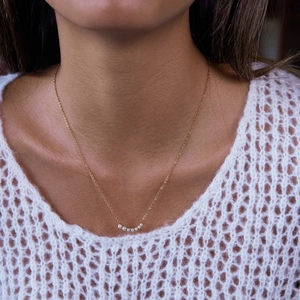 Elegant 18K gold stainless steel necklace with curved white pearl smiley pendant