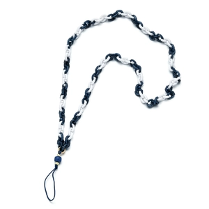 Detail of interlocking blue and white resin chain strap for phone cases with gold beads