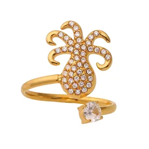 Detailed close-up of golden stainless steel pineapple ring with zircon pavé setting