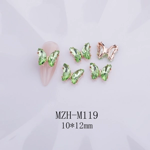 Detalle de dijes para uñas de mariposa de cristal con base de metal oro rosa MZH-M119