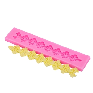 Macro view of long silicone mold with clover pattern for DIY cake fondant decorations