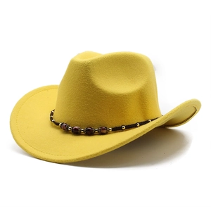 Bright yellow western cowboy hat with woven brown band and marble bead accents
