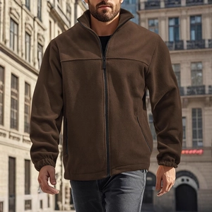 Detail of men's brown fleece jacket showing thick textured fabric and elastic cuffs