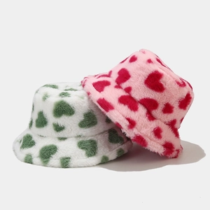 Plush faux fur bucket hats for women featuring cute heart patterns in white and pink