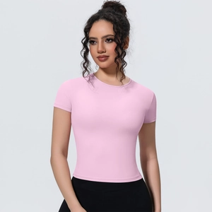 Close-up of pink slim fit yoga shirt with breathable fabric and athletic crew neck