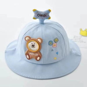 Detail of light blue baby bucket hat with 3D teddy bear and colorful ABC embroidery