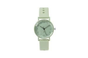 Detail of green silicone quartz watch featuring faceted glass and numerical dial display
