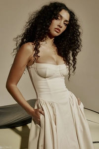 Close-up of the French vintage corset dress with elegant straps and textured ivory fabric