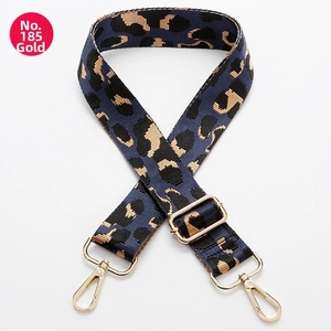 Detail of adjustable leopard print shoulder strap with gold hardware hooks and buckle
