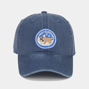 Washed navy cotton baseball cap with embroidered sleeping bear and stars on the front