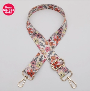 Close-up of multicolor floral bag strap No. 634 with adjustable gold metal buckles