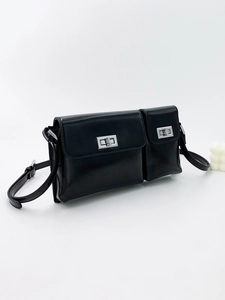 Elegant black leather baguette shoulder bag with silver twist lock and dual pocket design