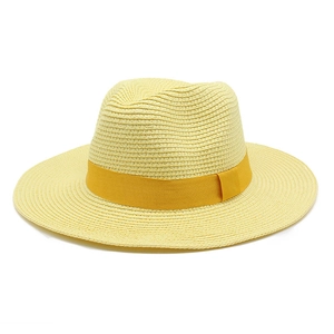 Detailed view of the fine woven texture and yellow ribbon on the straw Panama hat