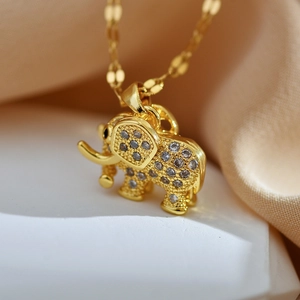 Elegant gold plated elephant pendant necklace featuring shimmering white zircon stones