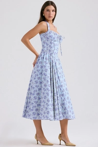 Close-up of light blue floral dress showing halter neck and drawstring chest detail