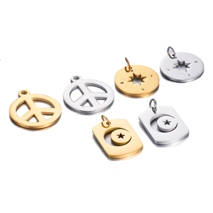 Pendentifs en acier inoxydable doré et argenté avec symboles de paix, étoile et boussole