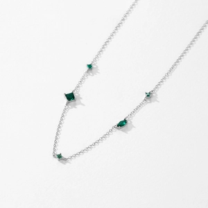 Retro S925 sterling silver necklace with five emerald-green zircons on white background
