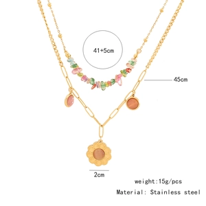 Detailed view of double-layer stainless steel necklace with bead chain and flower pendant