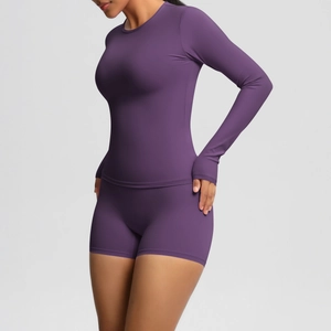 Close-up of premium purple sports fabric texture on long sleeve slim yoga top