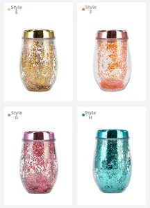 Macro detail of four glitter-filled double-wall egg-shaped cups with shiny metallic lids