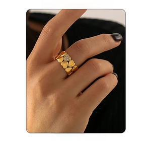 Detail of 18K gold plated heart ring featuring stacked hearts and pavé cubic zirconia