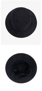 Detail of breathable black mesh lining and adjustable chin strap on the sun hat