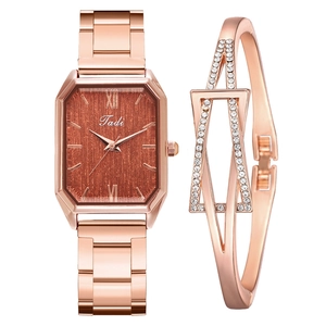 Detail of rose gold square watch with brown textured dial and matching rhinestone bracelet