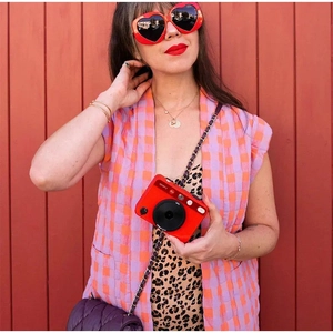 Red plaid sleeveless vest paired with matching straight pants for casual women's outfit