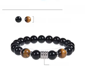Detail showing 10mm obsidian and tiger eye stone beads with stainless steel charm