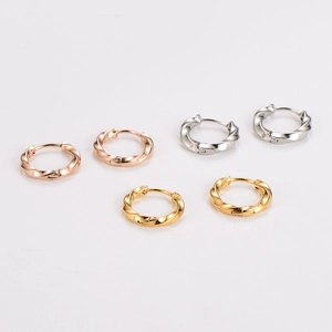 Set of three twisted hoop earrings in rose gold, silver, and gold stainless steel