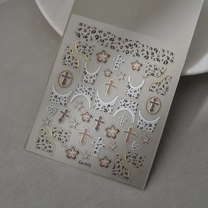 Embossed leopard print nail art stickers with gold crosses and floral star designs
