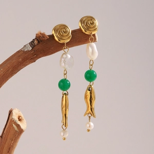 Detail of 18K gold-plated fish earrings with baroque pearls and green stone on branch