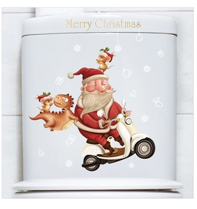 Detail of Santa Claus and Merry Christmas decals applied to a white toilet water tank