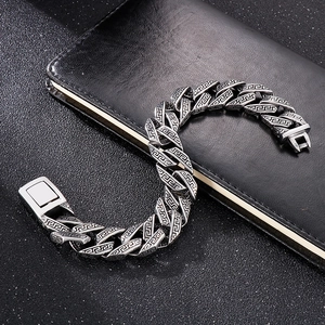 Vintage silver Cuban chain bracelet for men featuring Greek fret patterns on dark leather