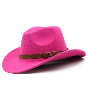 Detailed close-up of bright pink felt fedora hat with brown leather strap and buckle
