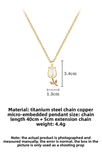 Detail view of gold tulip pendant necklace with dimensions 3.4x1.3cm and chain length