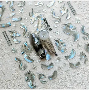Detail of silver holographic dragon nail stickers with traditional Chinese art motifs