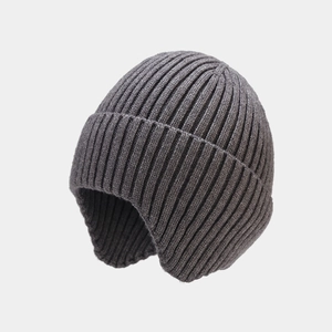 Close-up of deep gray rib-knit ear-protection beanie with warm textured wool blend